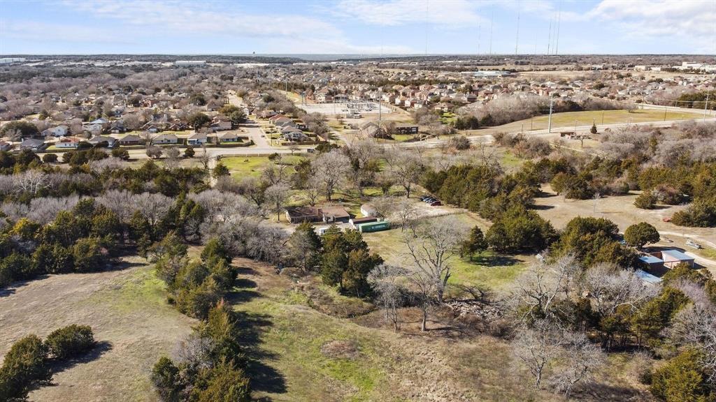 1006 South Clark Road Cedar Hill, TX 75104 - Photo 28 of 29 an aerial view of a houses with a lake