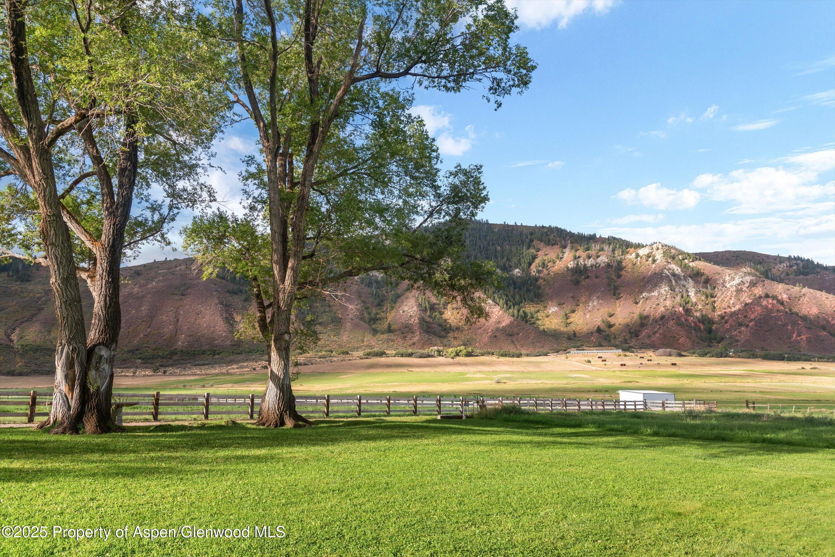 2700 Emma Road Basalt, CO 81621 - Photo 3 of 36 a view of a lake with a mountain