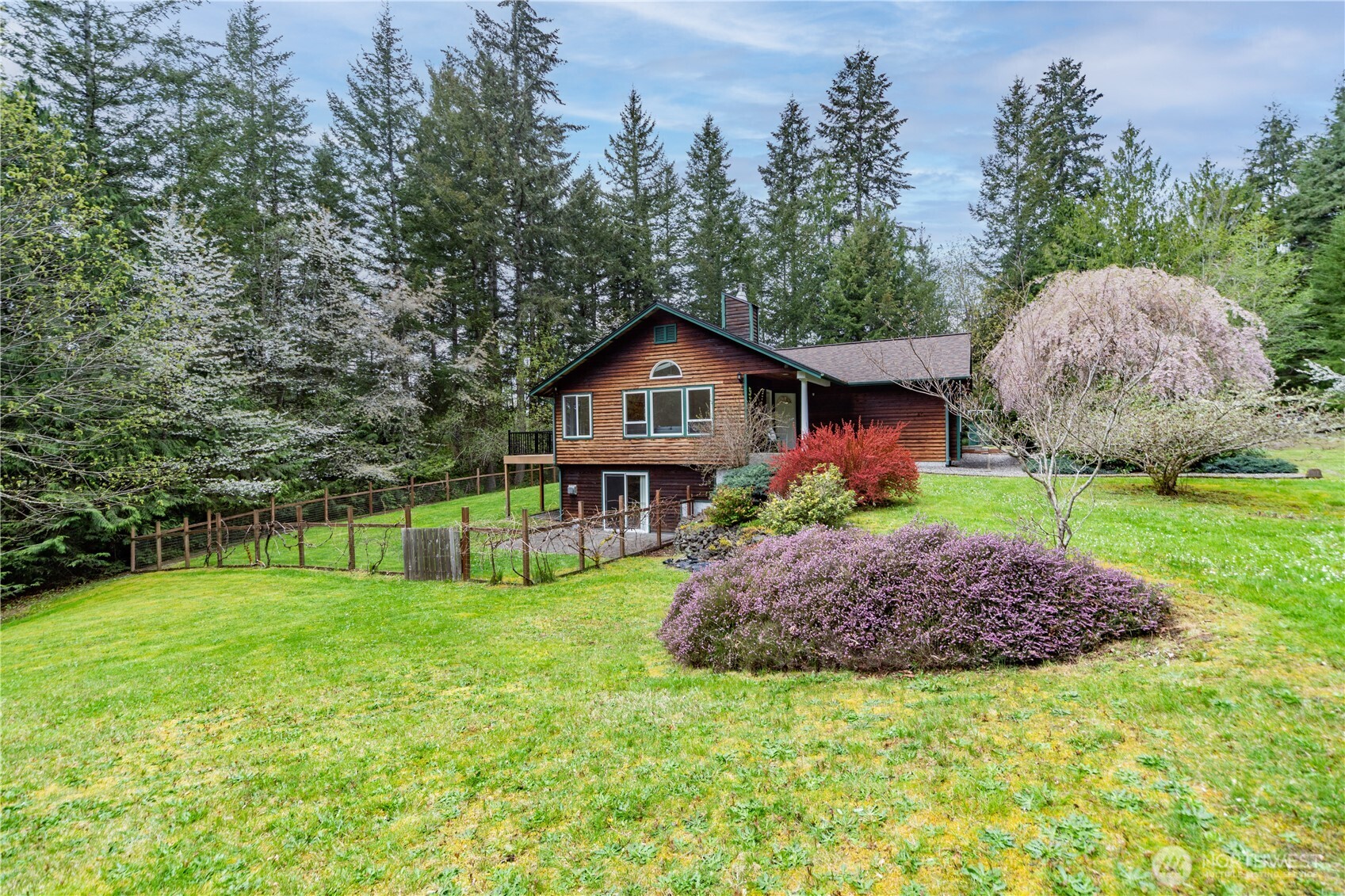 2882 Beaver Valley Road Port Ludlow, WA 98365 - Photo 1 of 34 a house with a big yard and large trees