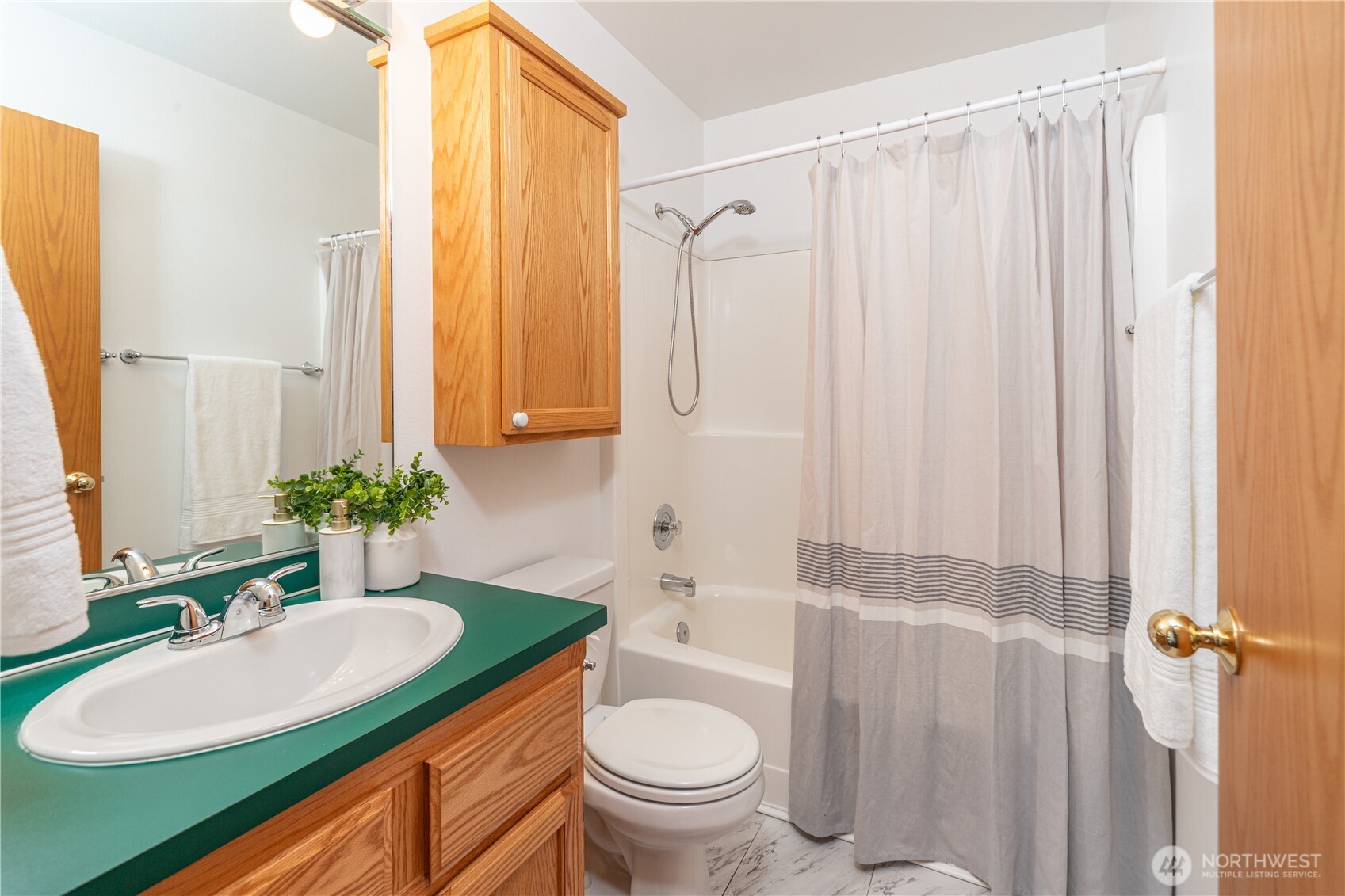 2882 Beaver Valley Road Port Ludlow, WA 98365 - Photo 19 of 34 a bathroom with a granite countertop sink toilet and mirror