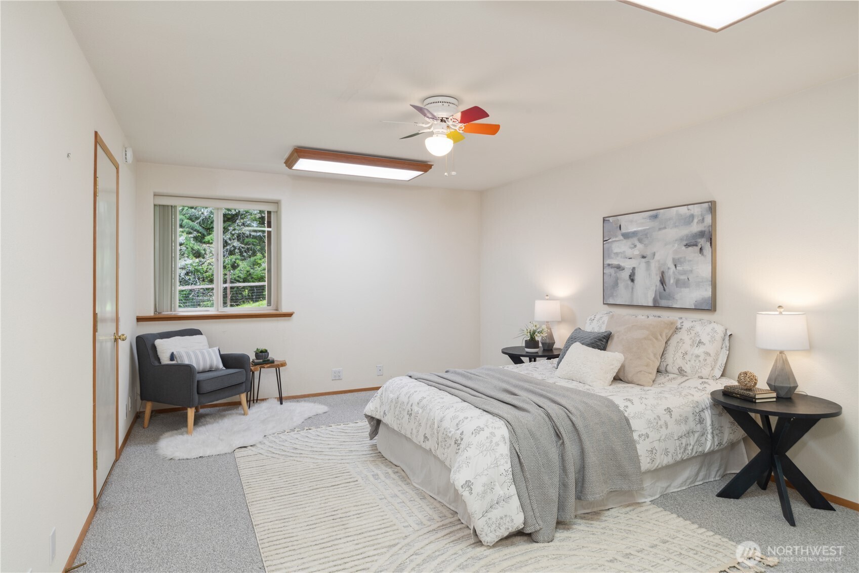 2882 Beaver Valley Road Port Ludlow, WA 98365 - Photo 23 of 34 a bedroom with a bed and a chandelier