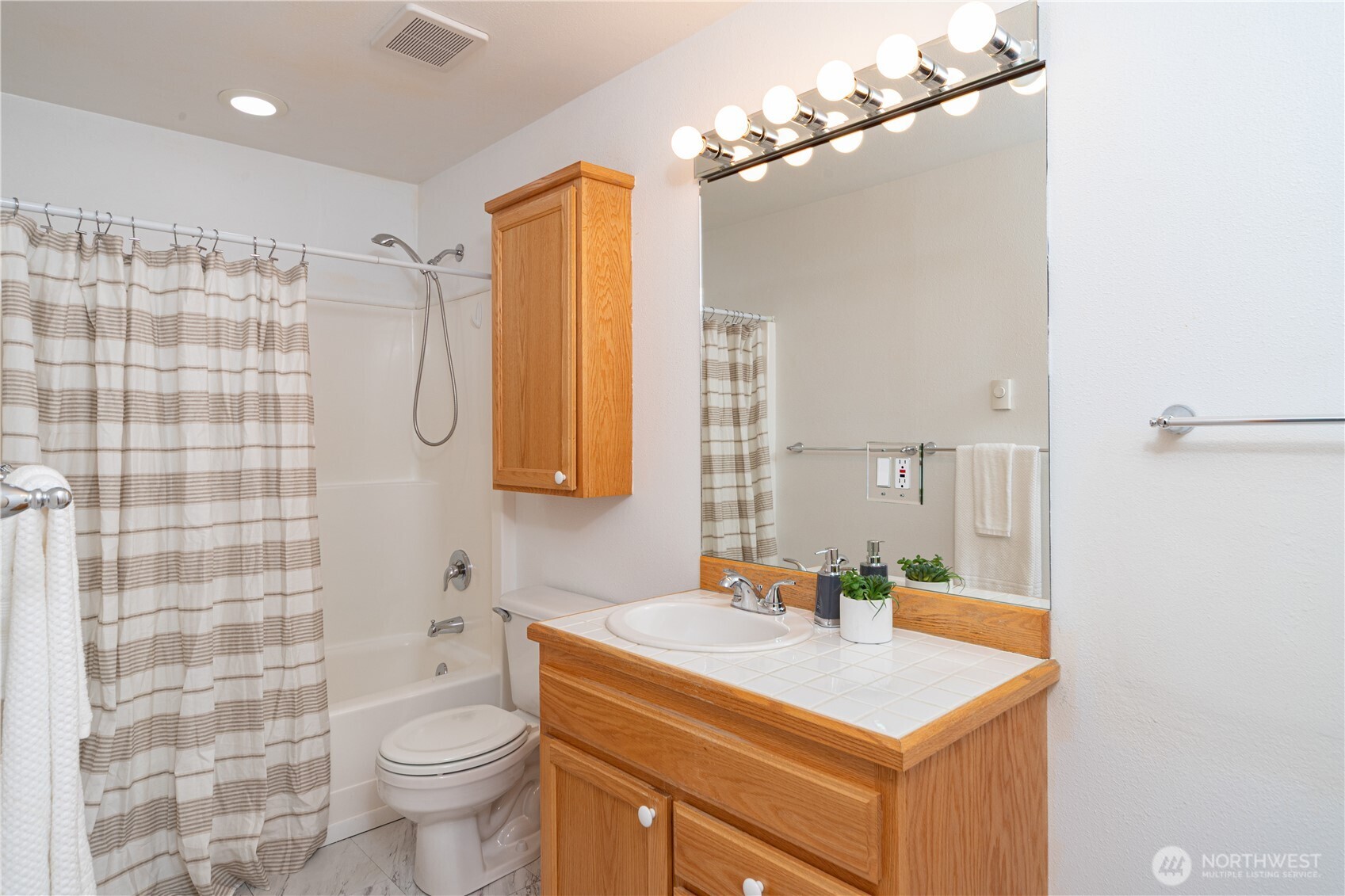 2882 Beaver Valley Road Port Ludlow, WA 98365 - Photo 24 of 34 a bathroom with a sink toilet double vanity and shower