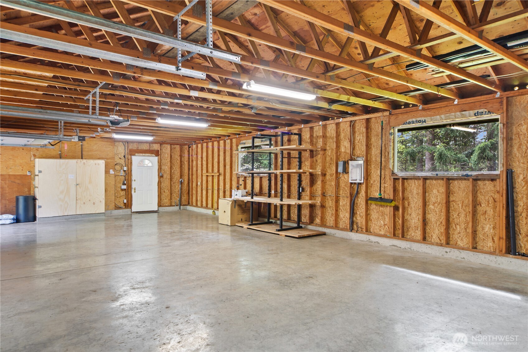 2882 Beaver Valley Road Port Ludlow, WA 98365 - Photo 29 of 34 a view of an empty room with wooden walls
