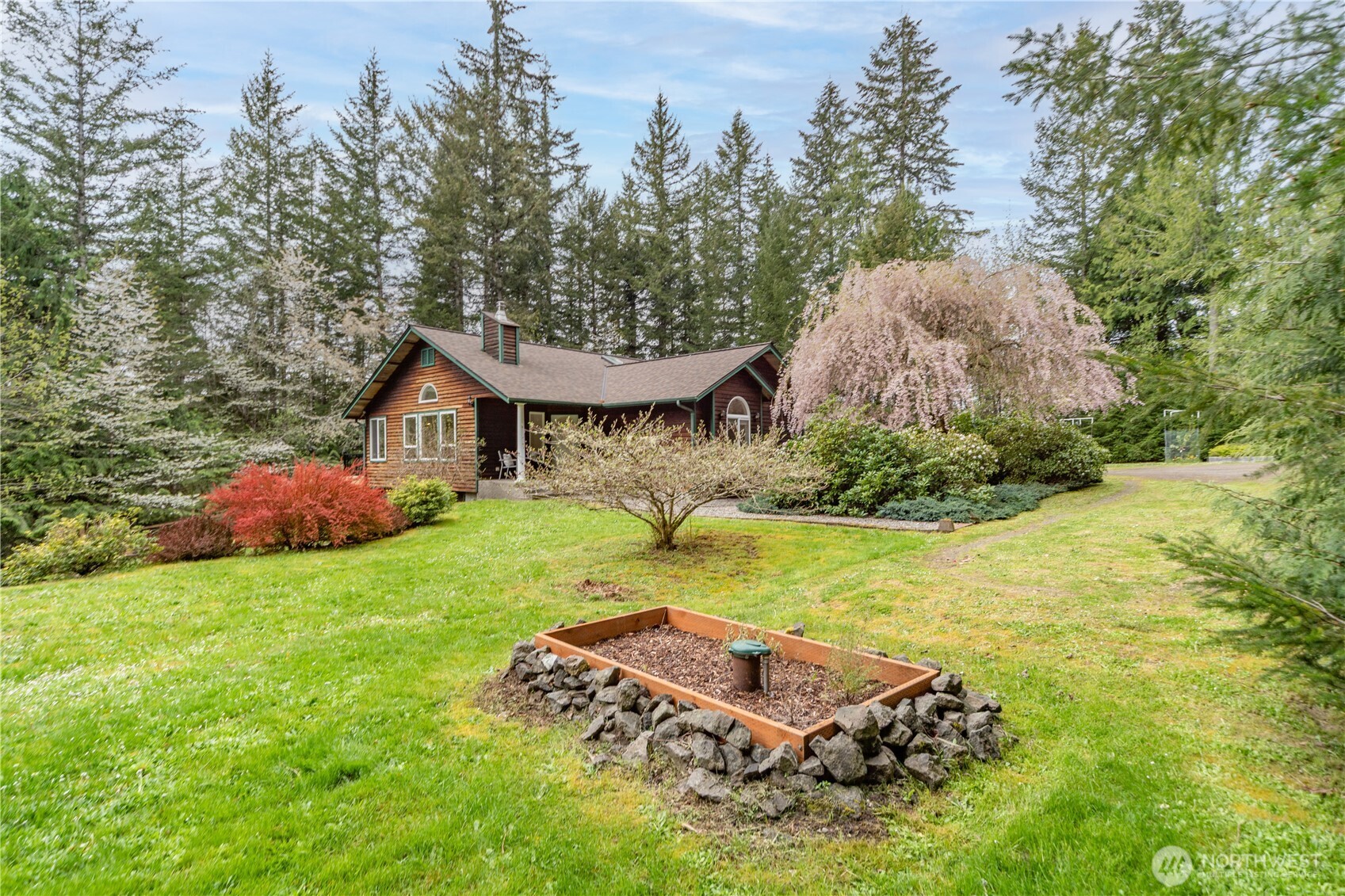 2882 Beaver Valley Road Port Ludlow, WA 98365 - Photo 31 of 34 a view of a house with a yard