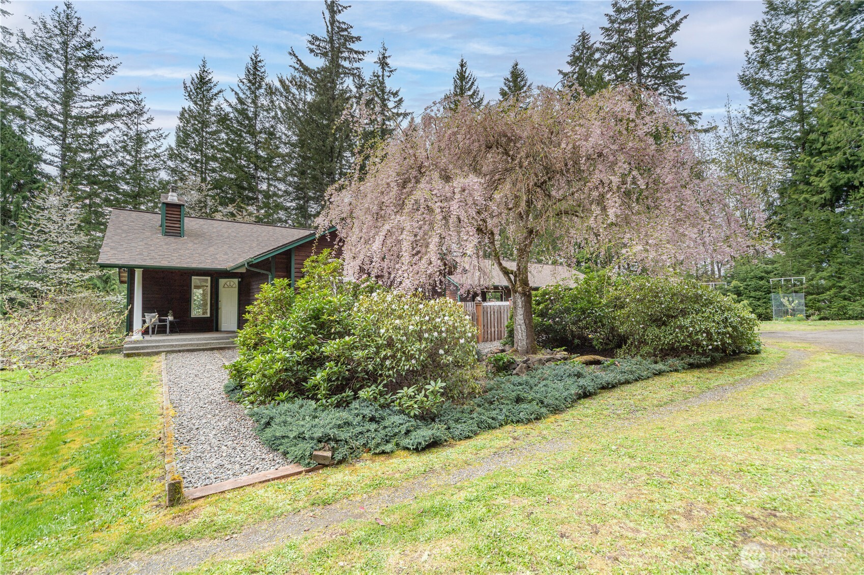 2882 Beaver Valley Road Port Ludlow, WA 98365 - Photo 32 of 34 a front view of a house with a yard