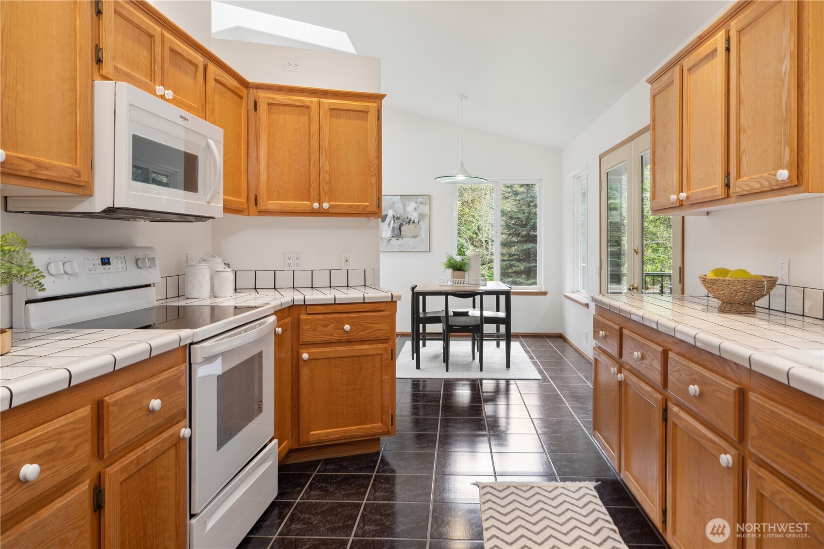 2882 Beaver Valley Road Port Ludlow, WA 98365 - Photo 8 of 34 a kitchen with stainless steel appliances granite countertop a stove a sink and a microwave