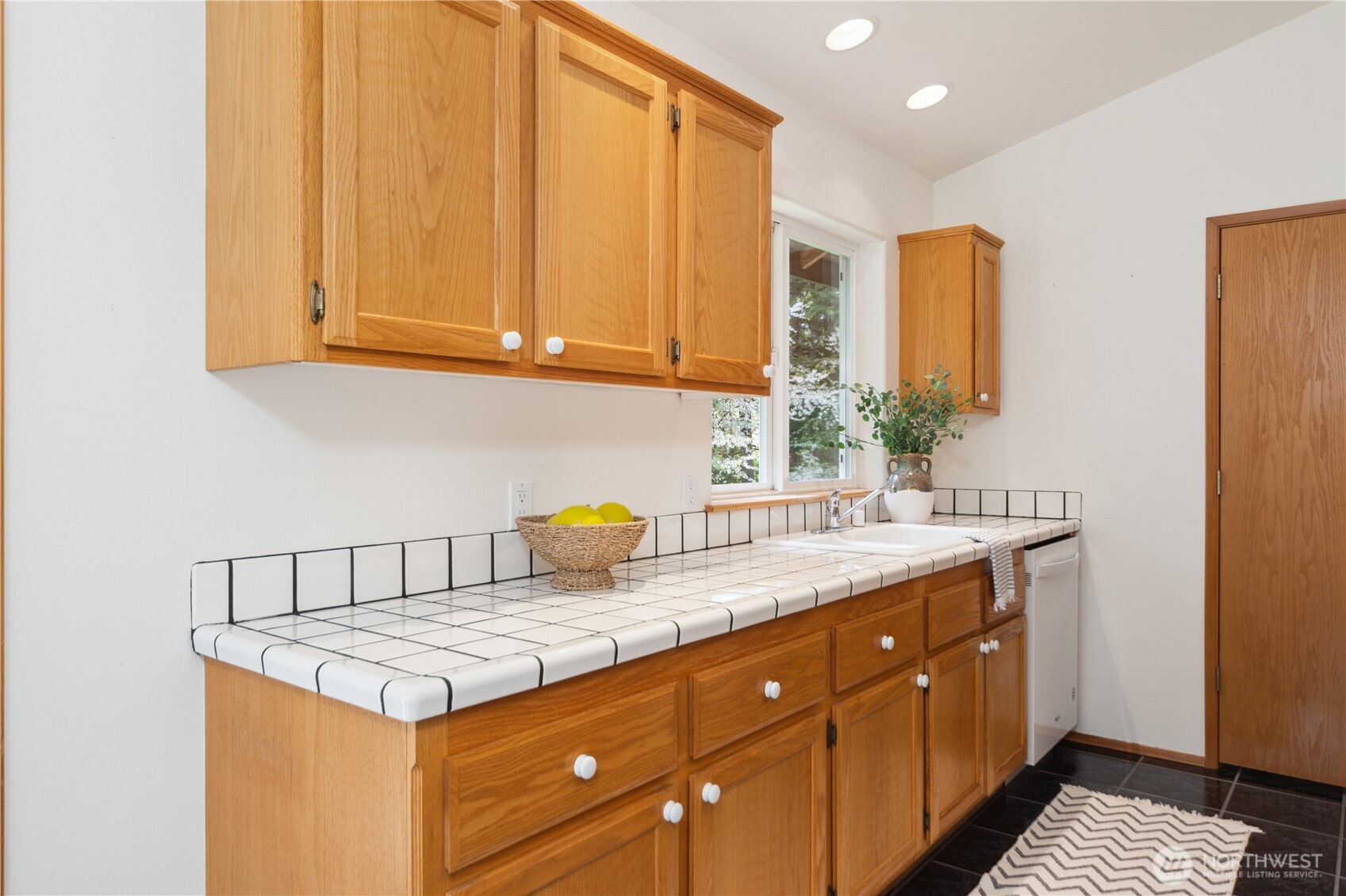 2882 Beaver Valley Road Port Ludlow, WA 98365 - Photo 9 of 34 a kitchen with a sink and cabinets