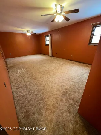 a bathroom with a toilet a sink and a mirror
