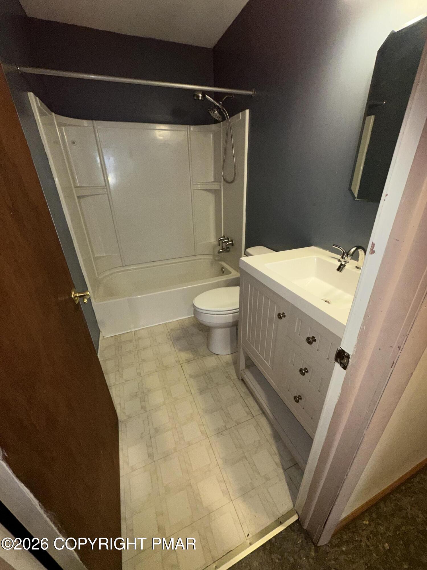 351 Charles Folly Road Bartonsville, PA 18321 - Photo 17 of 25 a bathroom with a granite countertop sink toilet and shower