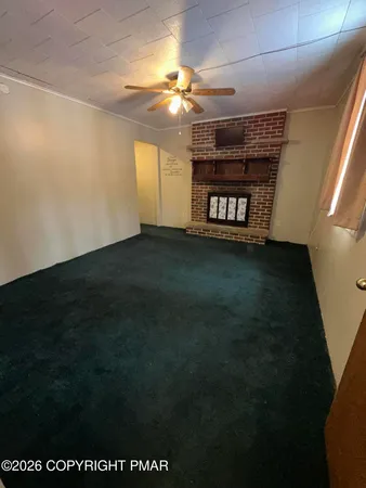 a bedroom with a bed and a mirror