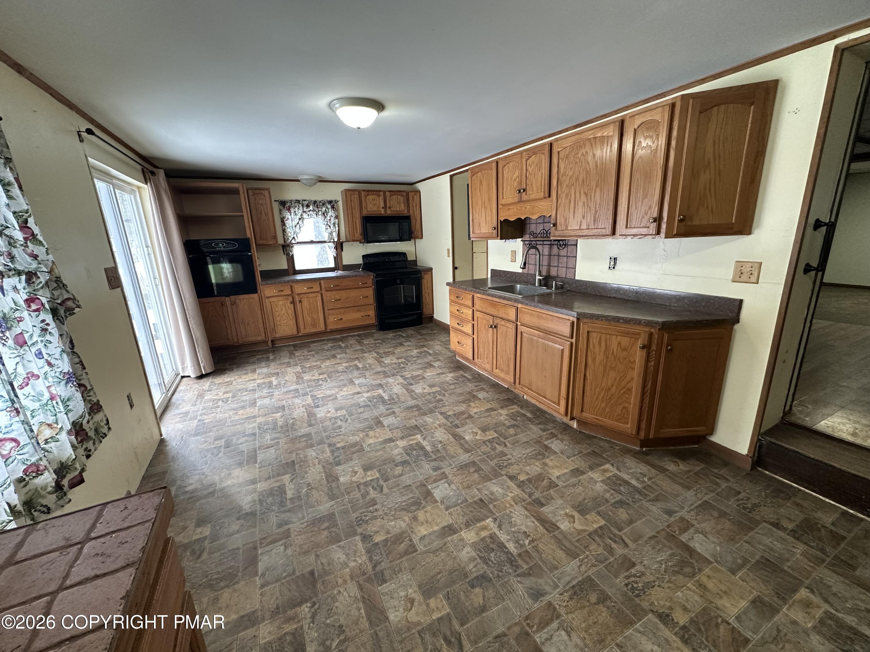 351 Charles Folly Road Bartonsville, PA 18321 - Photo 8 of 25 a large kitchen with stainless steel appliances granite countertop a refrigerator and a stove top oven