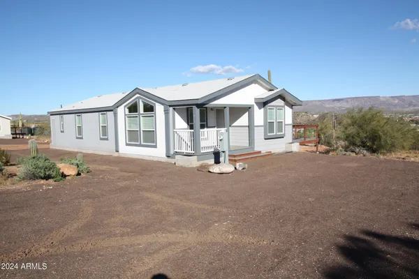 a view of a house with a yard and garage