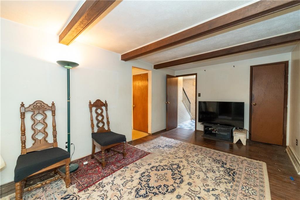 1050 Princeton Road Pittsburgh, PA 15205 - Photo 11 of 34 a living room with furniture a rug and a window