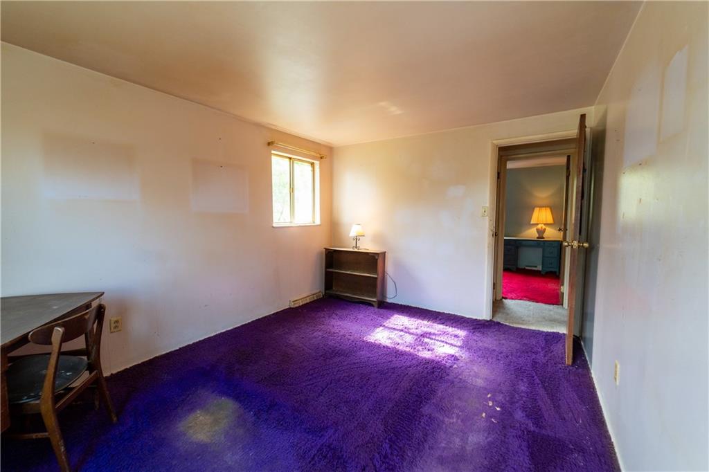 1050 Princeton Road Pittsburgh, PA 15205 - Photo 23 of 34 a view of an empty room with wooden floor and a window