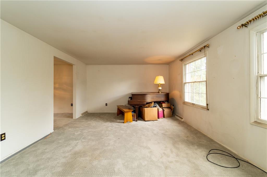 1050 Princeton Road Pittsburgh, PA 15205 - Photo 4 of 34 a living room with furniture and a large window