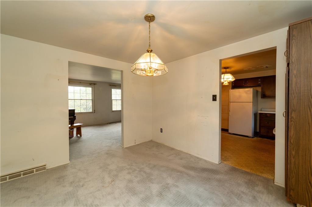 1050 Princeton Road Pittsburgh, PA 15205 - Photo 5 of 34 a view of a room with wooden floor staircase and a hallway