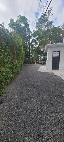 a view of a house with a yard and garage