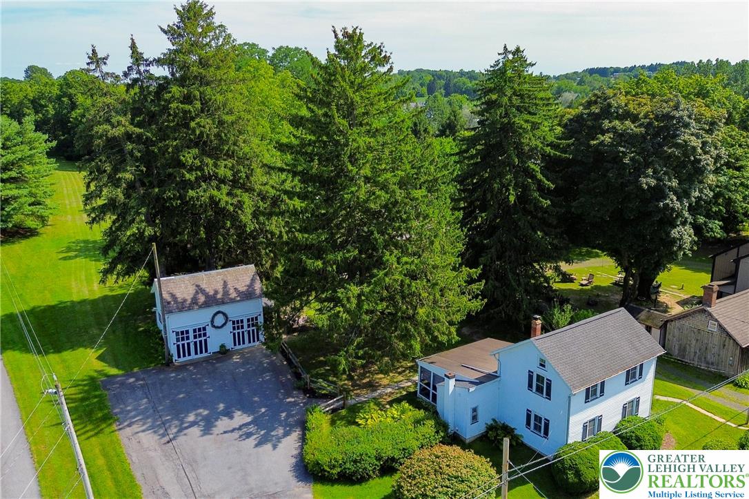 666 Point Phillips Road Bath, PA 18014 - Photo 8 of 68 An aerial perspective reveals this home's tranquil setting amid mature trees and green expanses.