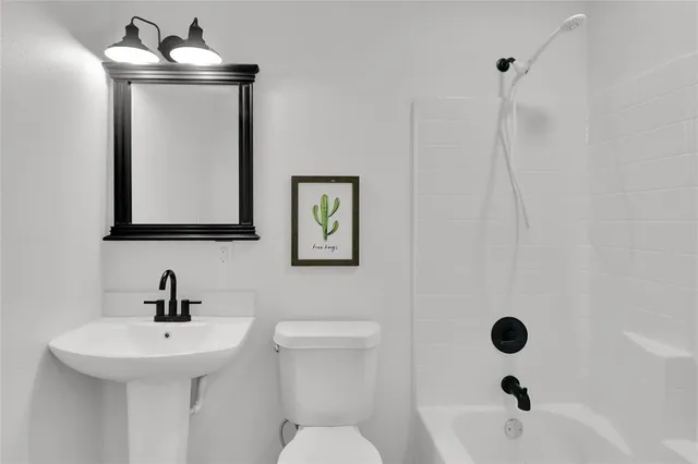 a bathroom with a sink and mirror
