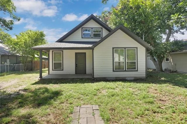 a house view with a garden space