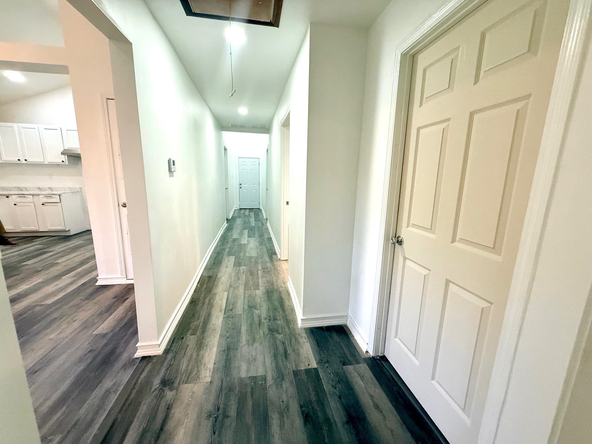 3054 Lotus Road Memphis, TN 38109 - Photo 23 of 29 a view of a hallway with wooden floor and staircase