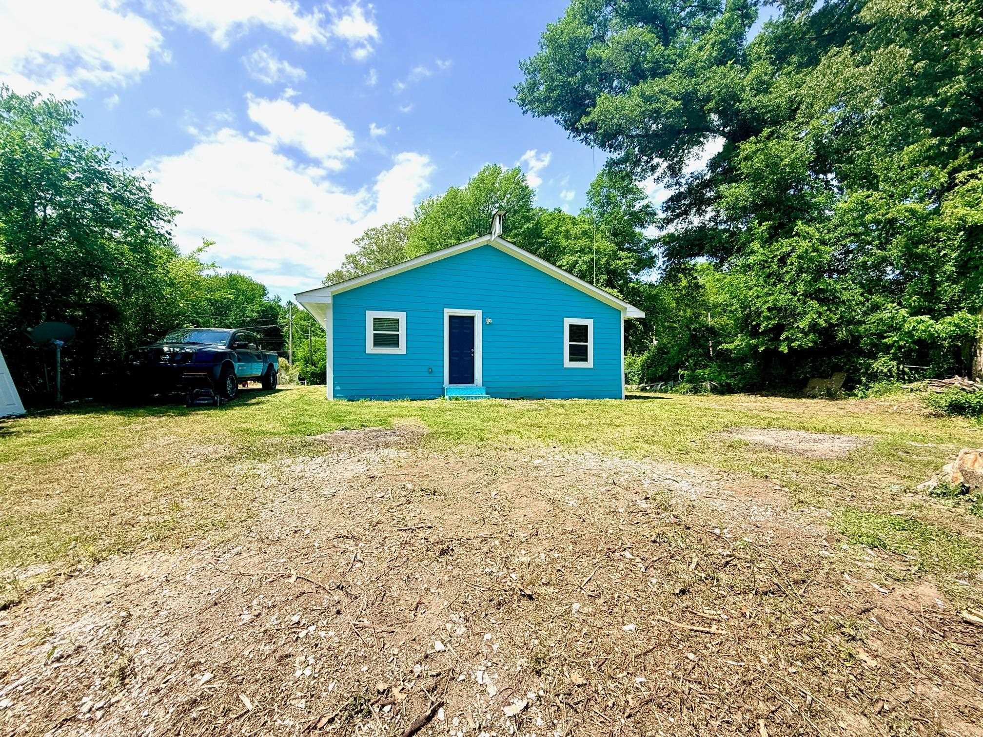 3054 Lotus Road Memphis, TN 38109 - Photo 27 of 29 a big house with a big yard and large trees
