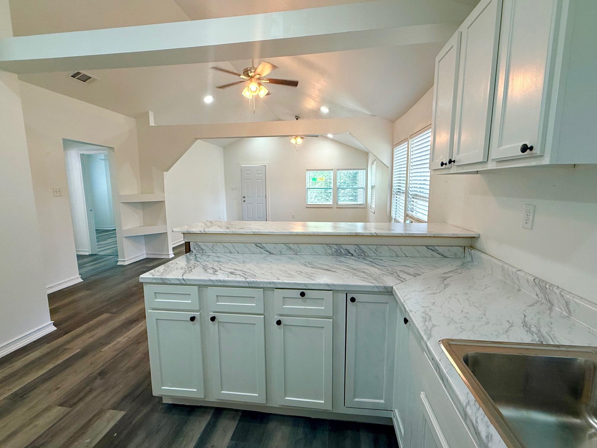 3054 Lotus Road Memphis, TN 38109 - Photo 8 of 29 a kitchen with a sink cabinets and window