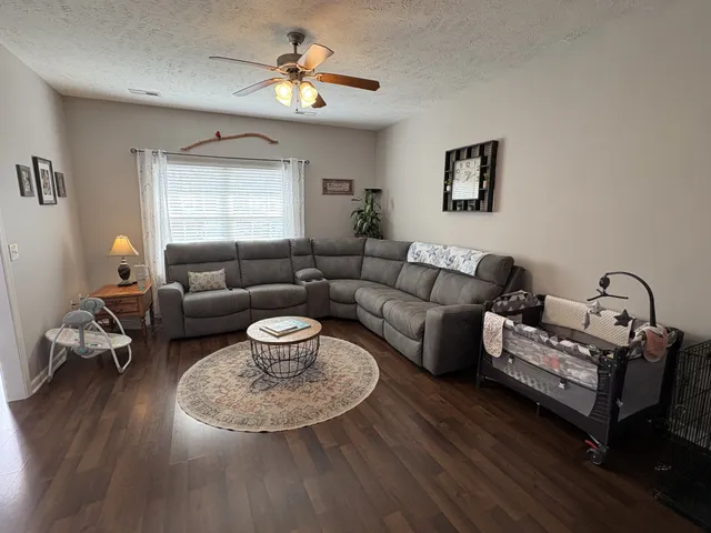 a living room with furniture and a window