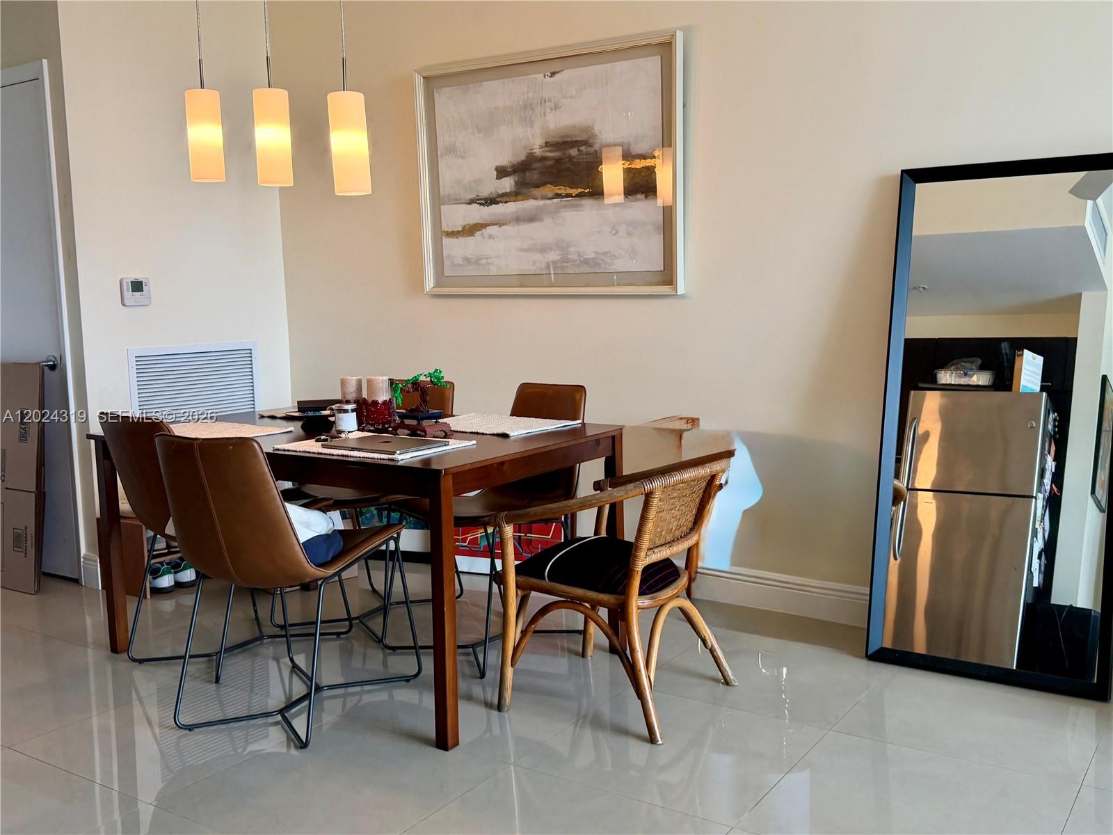 90 Southwest 3rd Street, Unit 1409 Miami, FL 33130 - Photo 8 of 25 a dining room with furniture and window