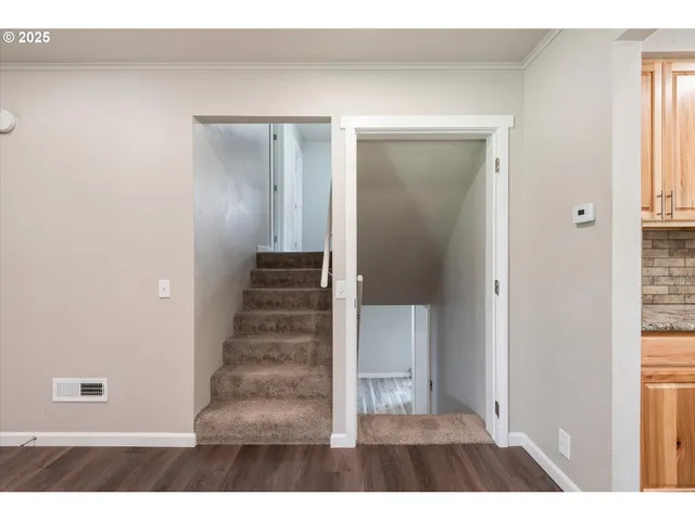 a view of a bathroom with wooden floor