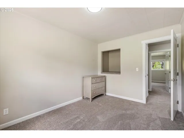 view of an empty room and closet