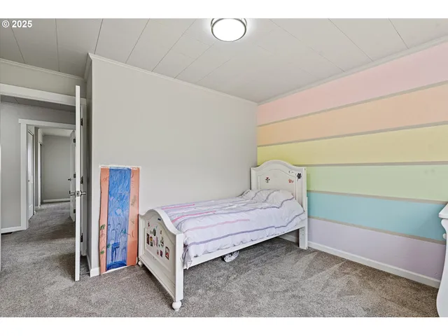 a bedroom with a bed and a cabinets