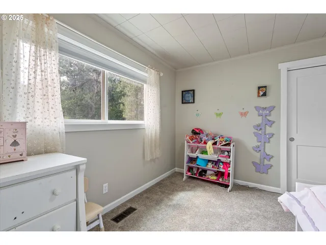 a utility room with toys and a window