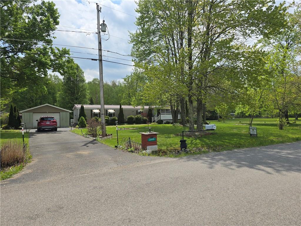 2495 Leach Road Linesville, PA 16424 - Photo 1 of 27 a view of a park with swings and slides