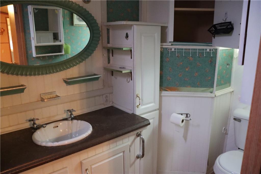 2495 Leach Road Linesville, PA 16424 - Photo 11 of 27 a bathroom with a sink and a mirror