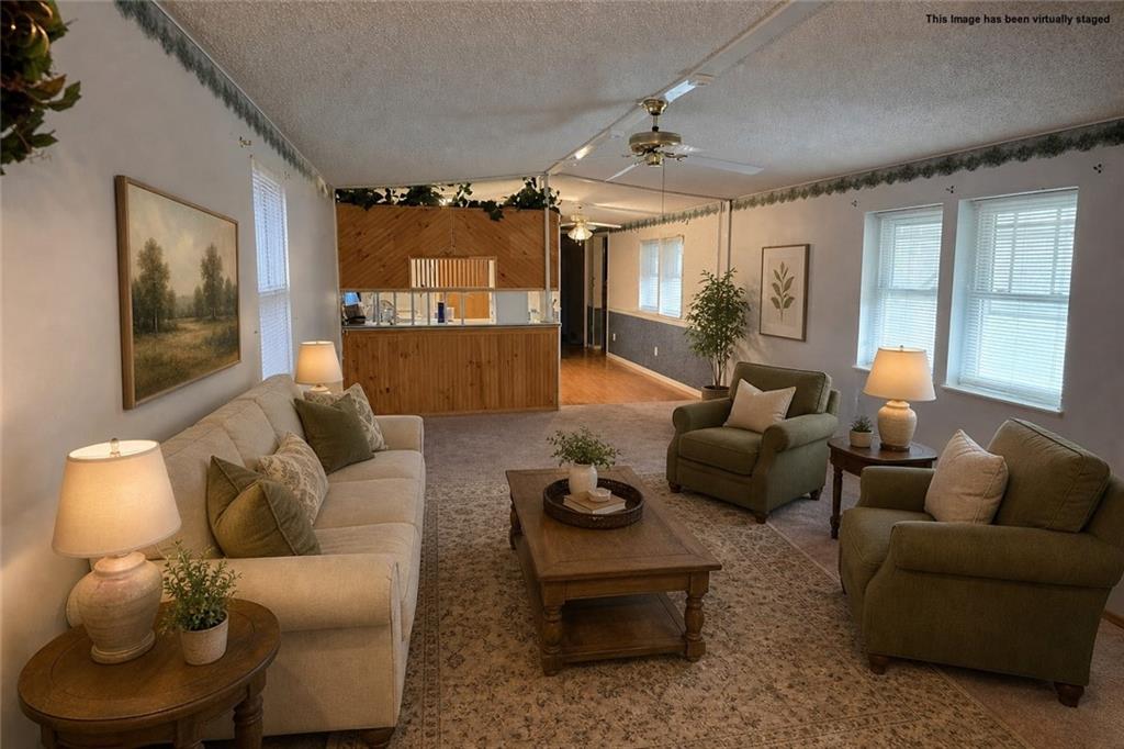 2495 Leach Road Linesville, PA 16424 - Photo 23 of 27 a living room with furniture and a large window