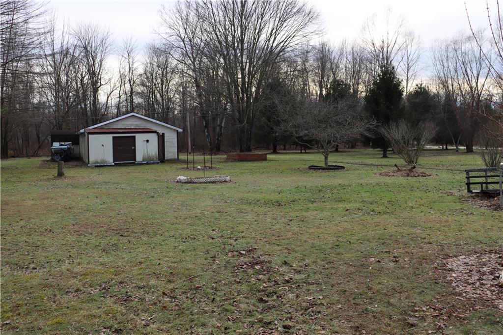2495 Leach Road Linesville, PA 16424 - Photo 6 of 27 a big room with lots of trees and plants