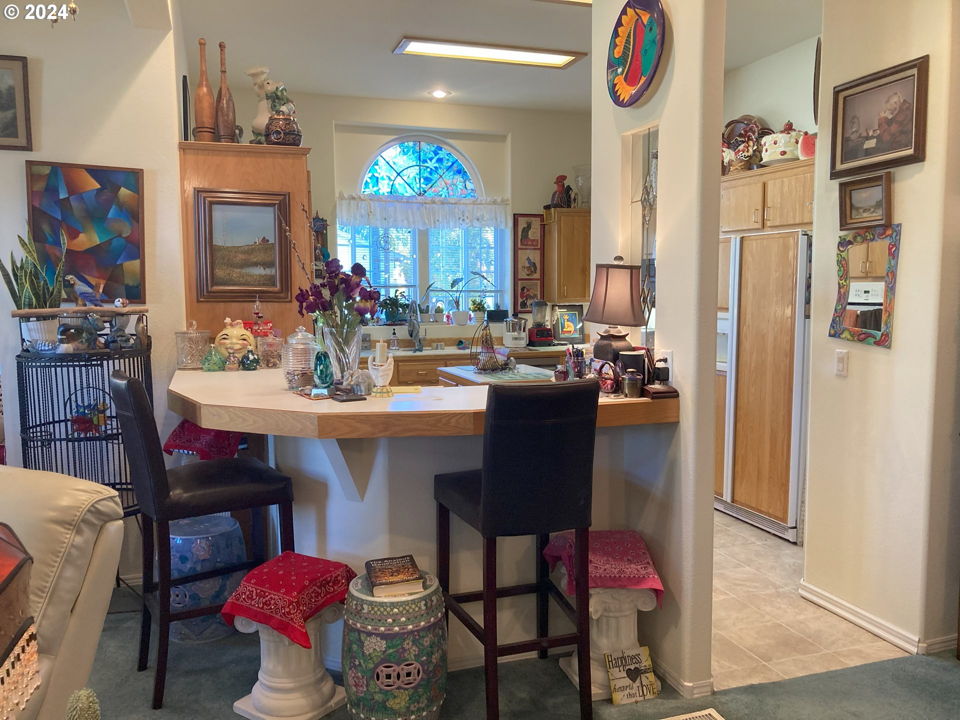 4055 Royal Avenue, Unit 25 Eugene, OR 97402 - Photo 13 of 42 a kitchen with a dining table and chairs