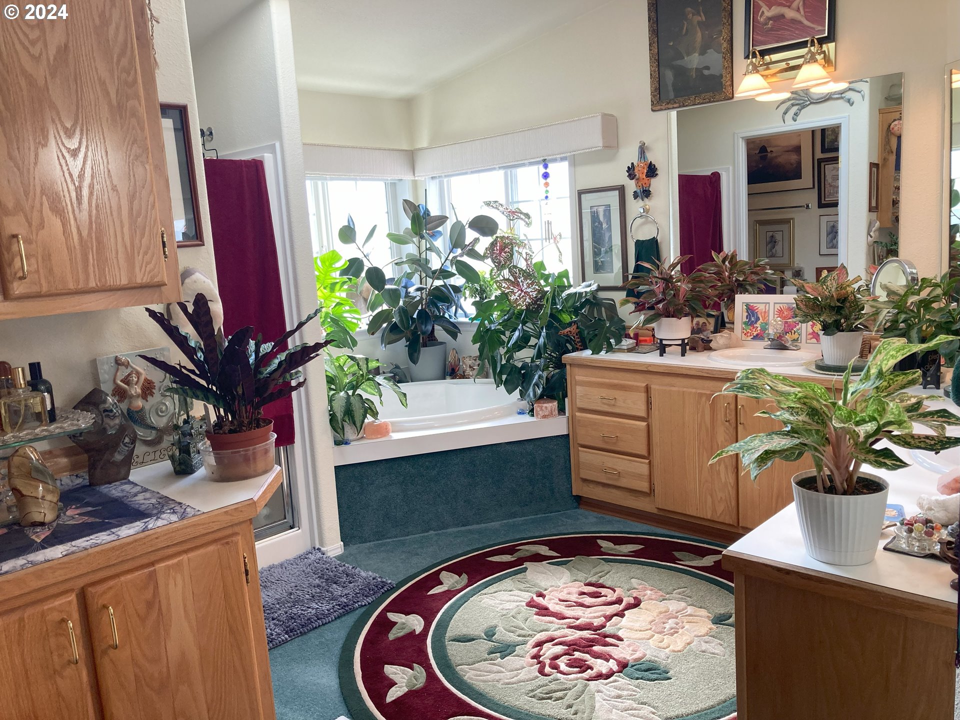 4055 Royal Avenue, Unit 25 Eugene, OR 97402 - Photo 28 of 42 a dining room with furniture a potted plant and a fireplace