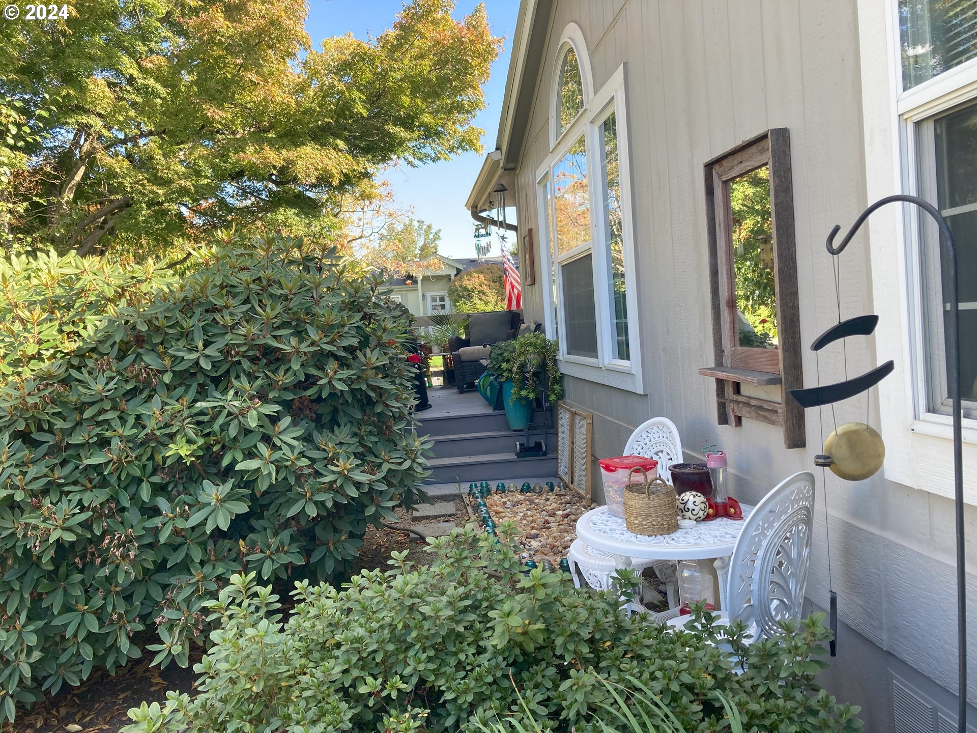4055 Royal Avenue, Unit 25 Eugene, OR 97402 - Photo 4 of 42 a front view of a house with table and chairs
