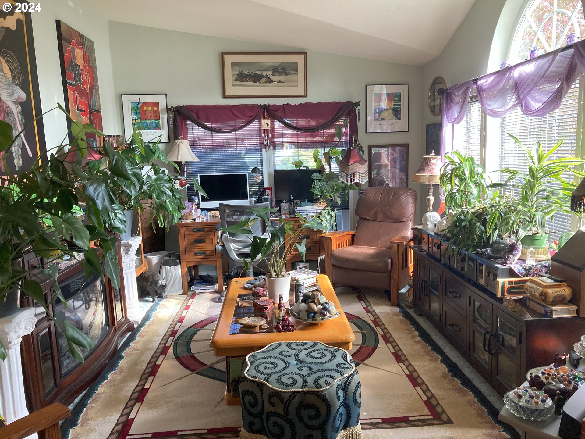 4055 Royal Avenue, Unit 25 Eugene, OR 97402 - Photo 8 of 42 a living room with furniture fireplace and a potted plant