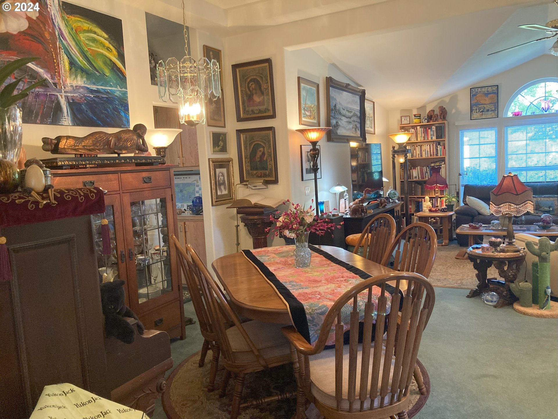 4055 Royal Avenue, Unit 25 Eugene, OR 97402 - Photo 10 of 42 a view of a dining room and livingroom with furniture window and wooden floor