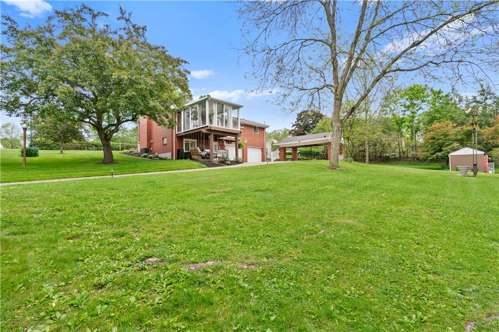 5431 Hamilton Road Gibsonia, PA 15044 - Photo 27 of 28 a view of a house with a big yard and large trees