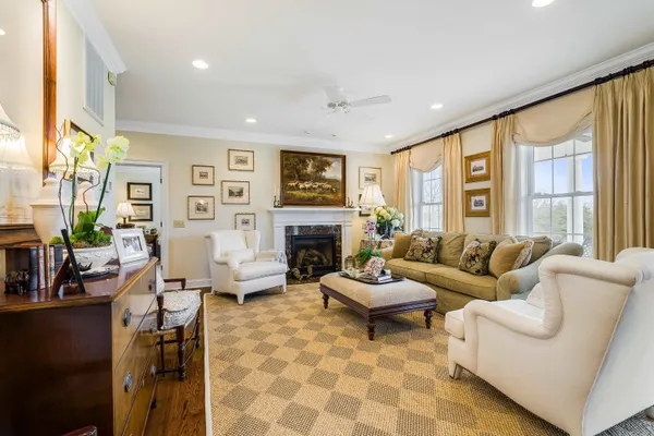 a living room with furniture and a piano