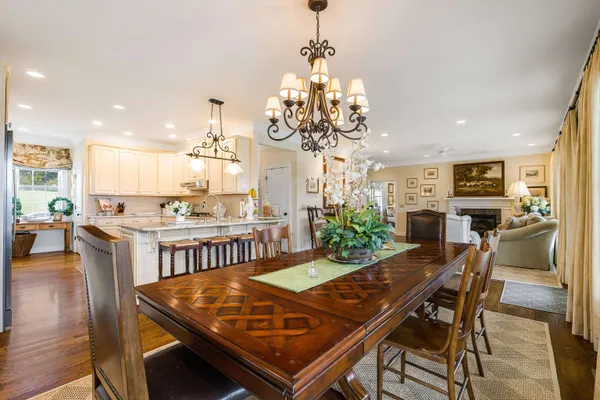 a bedroom with a bed and two windows