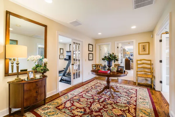 a bathroom with a sink toilet mirror and shower