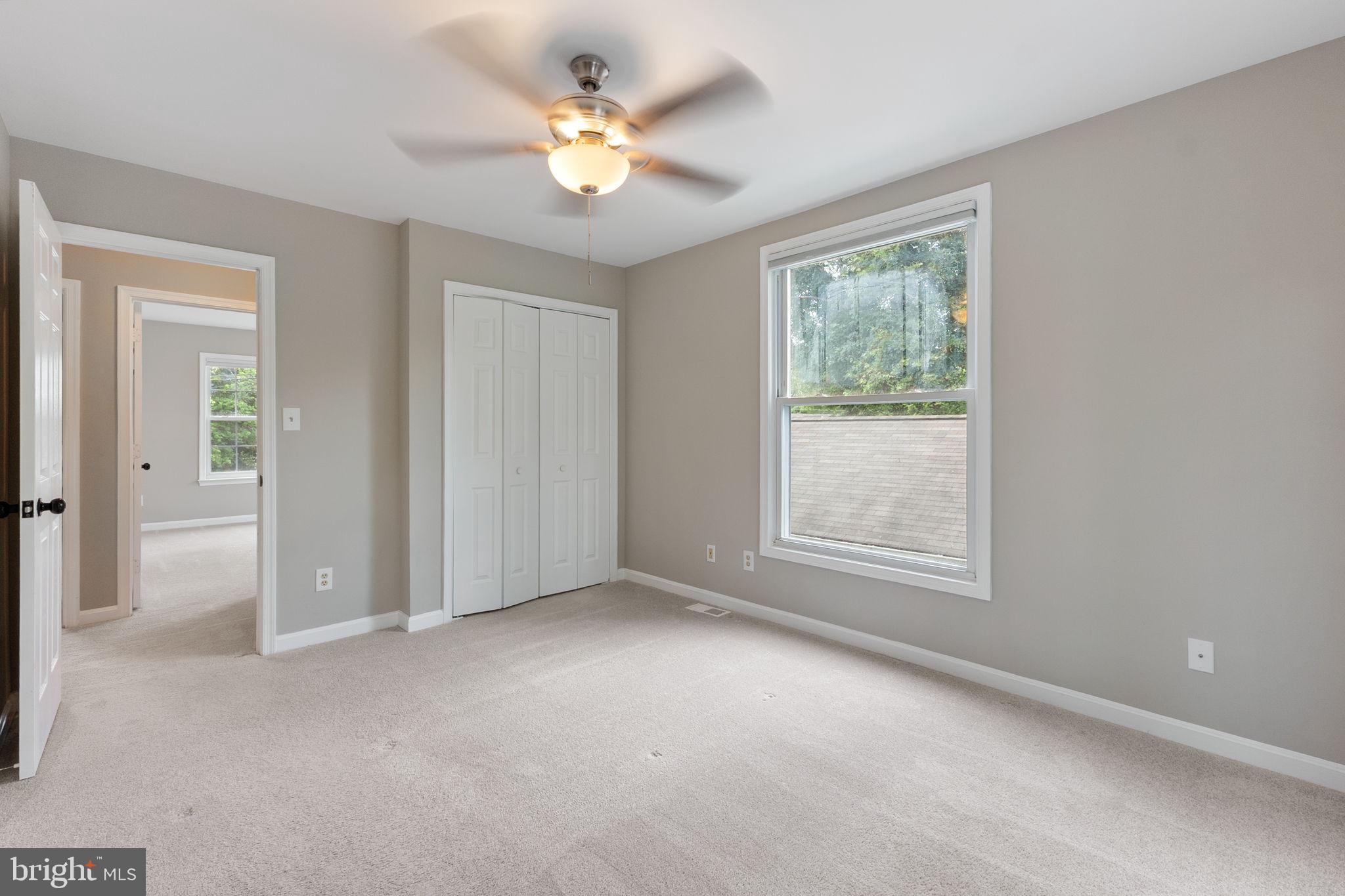 1527 Lincoln Road Shady Side, MD 20764 - Photo 17 of 30 an empty room with windows and fan