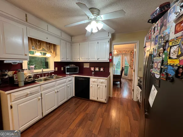 a stove top oven sitting inside of a kitchen