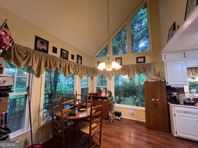 a bedroom with furniture and wooden floor