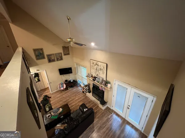 a view of a living room with furniture and a flat screen tv